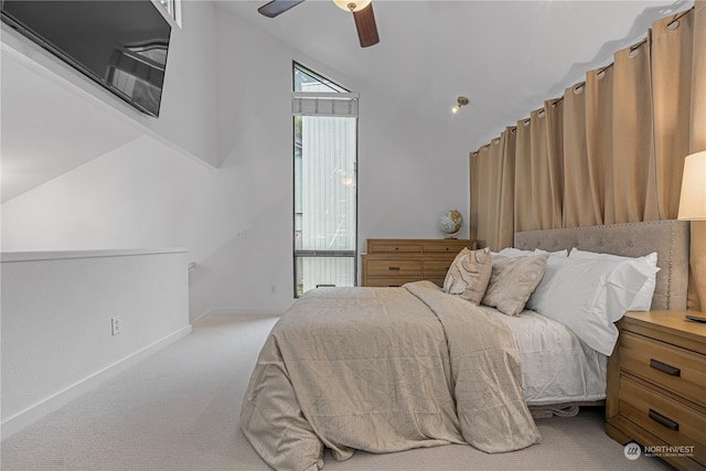 carpeted bedroom with lofted ceiling and ceiling fan