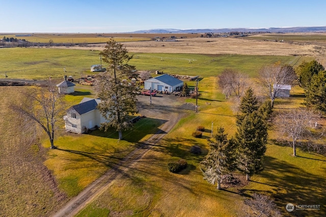 birds eye view of property with a rural view