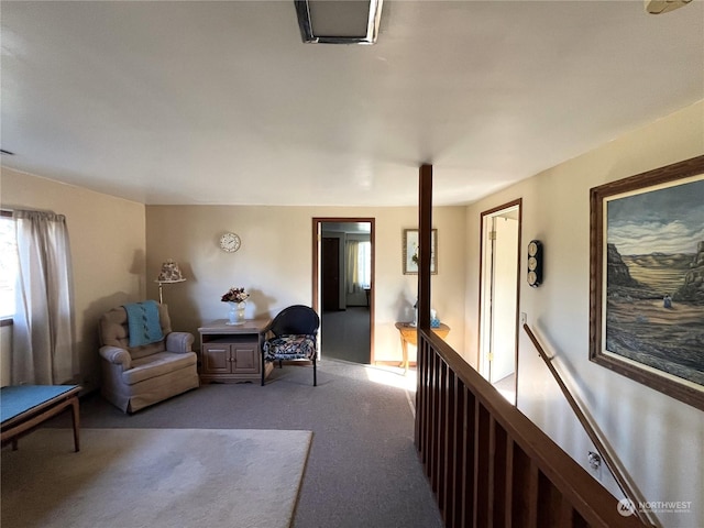 living area featuring light carpet