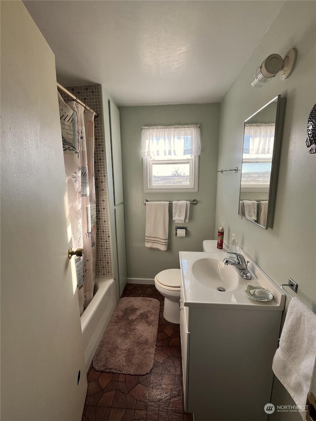 full bathroom featuring vanity, toilet, and shower / bath combo with shower curtain