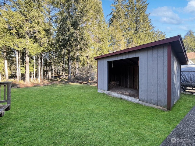 view of outdoor structure featuring a lawn