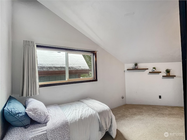 carpeted bedroom featuring vaulted ceiling