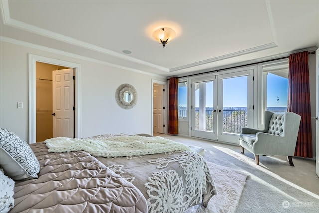 carpeted bedroom with french doors, crown molding, access to exterior, and a tray ceiling