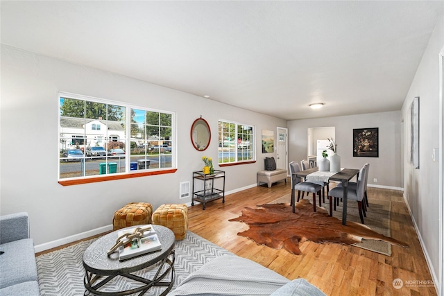 dining space featuring hardwood / wood-style floors