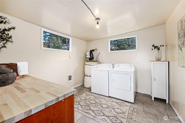 washroom featuring washer and clothes dryer