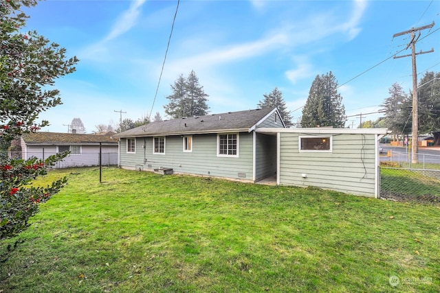 back of house with a yard