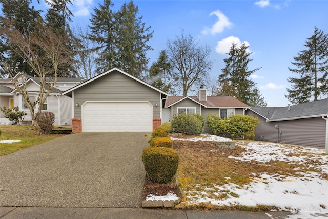 ranch-style house featuring a garage