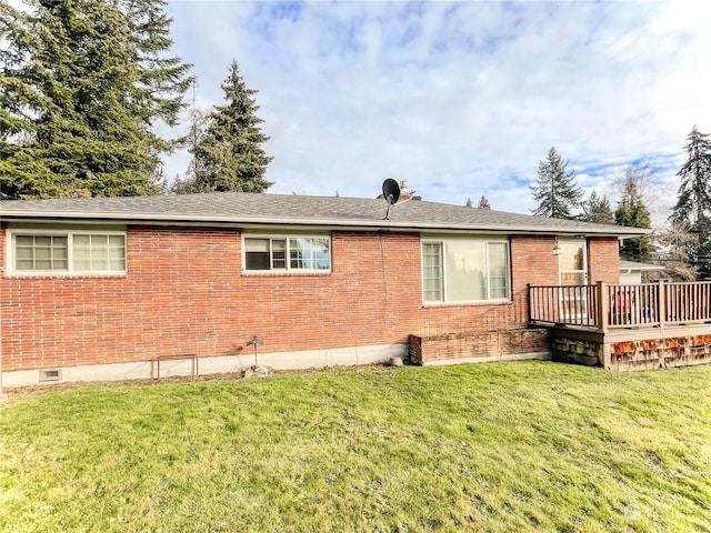 view of home's exterior featuring a lawn and a deck