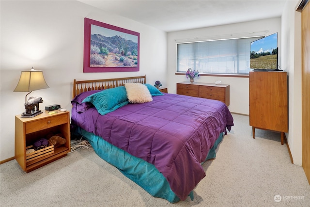 bedroom featuring light colored carpet