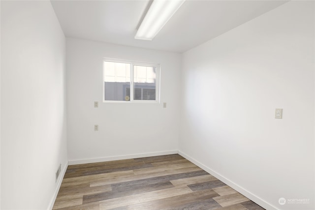 unfurnished room featuring wood-type flooring