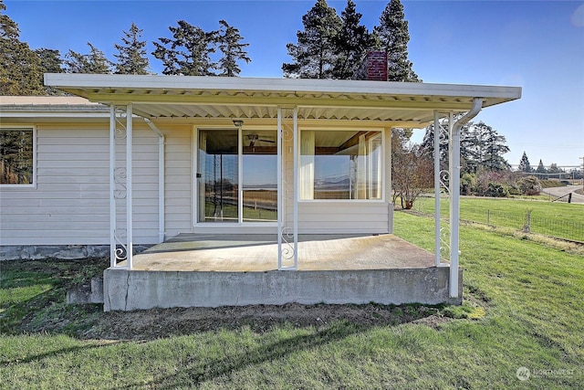 exterior space with a lawn and a patio area