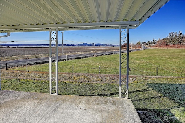 view of yard featuring a mountain view and a rural view