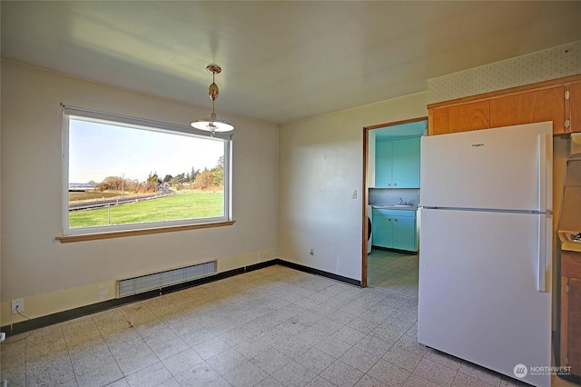 unfurnished dining area featuring washer / clothes dryer