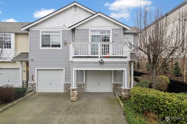 view of front of home featuring a garage and a balcony