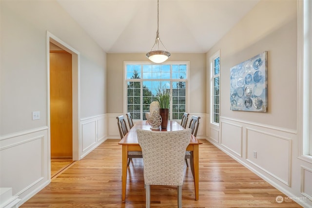 dining space with light hardwood / wood-style flooring