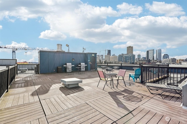 wooden deck featuring area for grilling