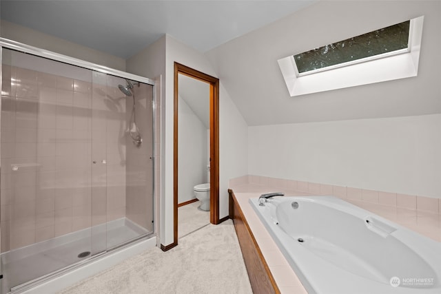 bathroom featuring lofted ceiling with skylight, independent shower and bath, and toilet