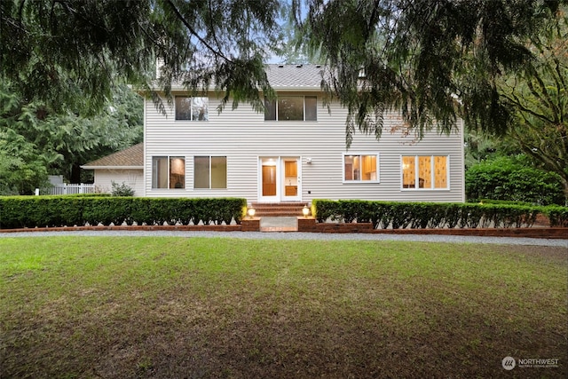 colonial-style house with a front yard