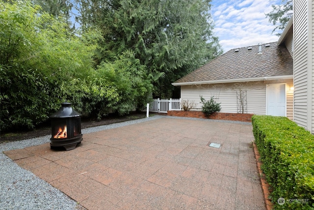 view of patio featuring an outdoor fire pit