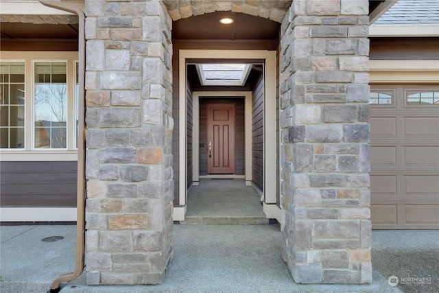 entrance to property featuring a garage