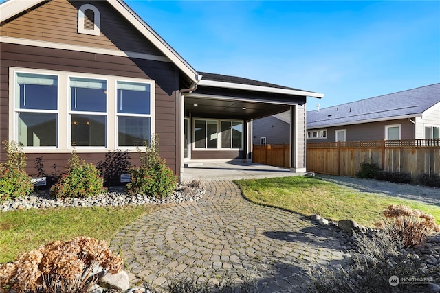 back of house featuring a yard and a patio area