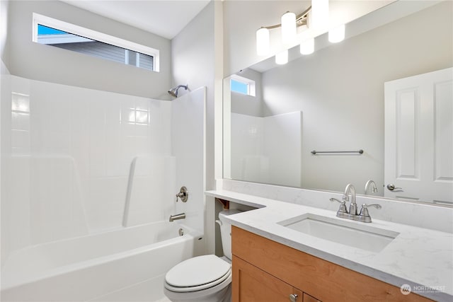 full bathroom with vanity, tub / shower combination, and toilet