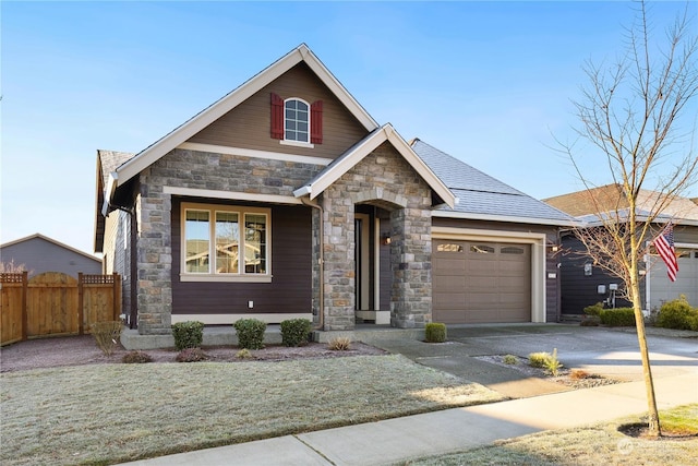 view of front of house featuring a garage and a front yard