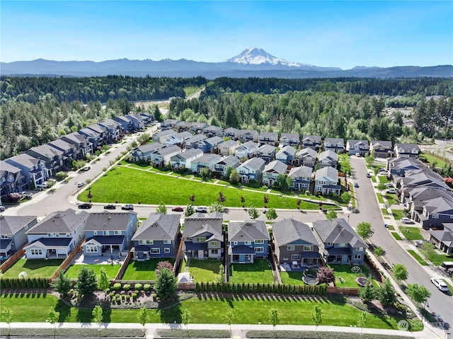 birds eye view of property with a mountain view