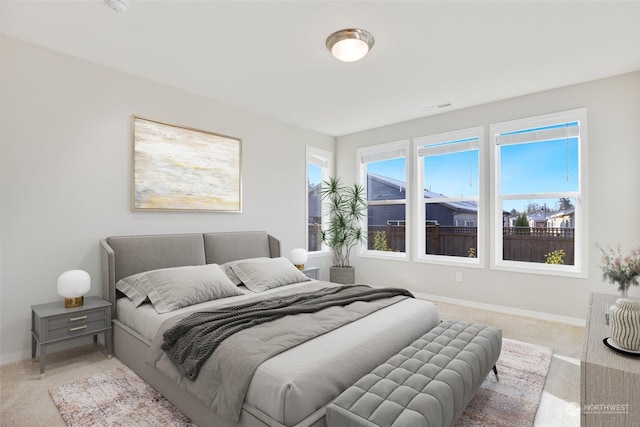 bedroom with light colored carpet