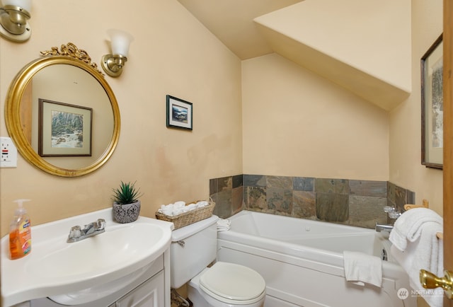 bathroom with vaulted ceiling, a bath, vanity, and toilet