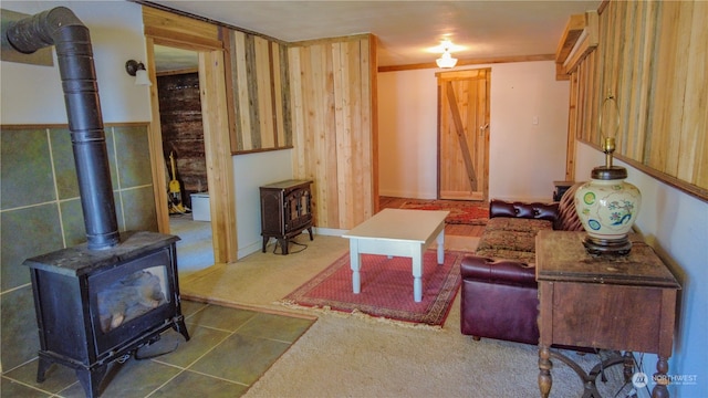 living room with dark carpet and a wood stove