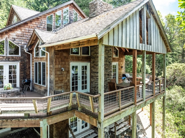 rear view of house featuring french doors