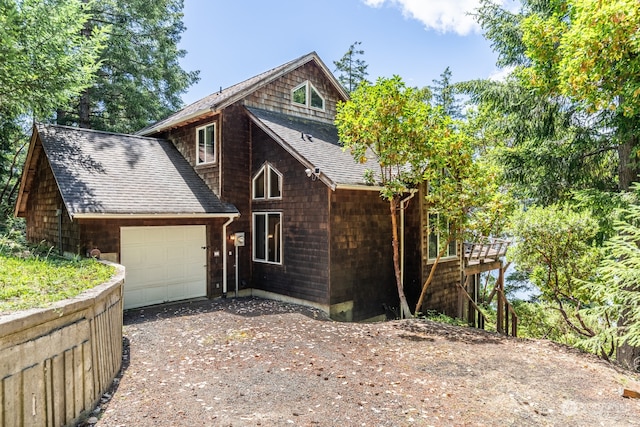 view of side of home featuring a garage