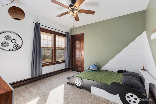 bedroom with light carpet and ceiling fan