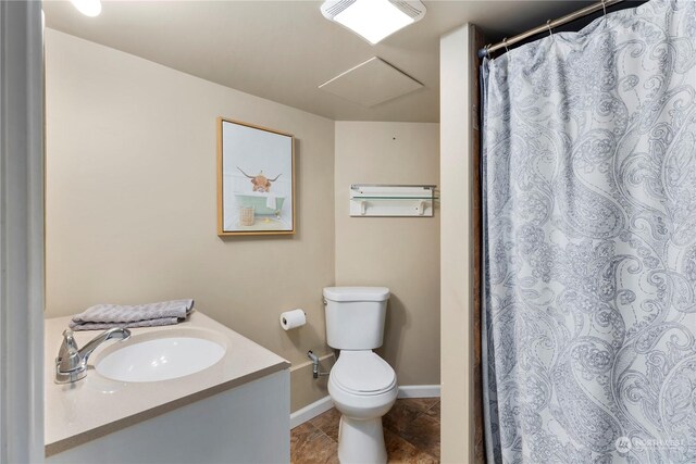 bathroom with tile patterned flooring, vanity, walk in shower, and toilet