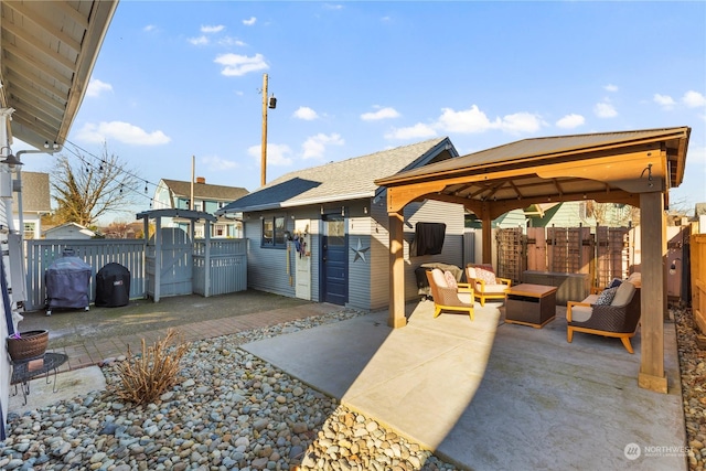 view of patio with a grill, a gazebo, and outdoor lounge area