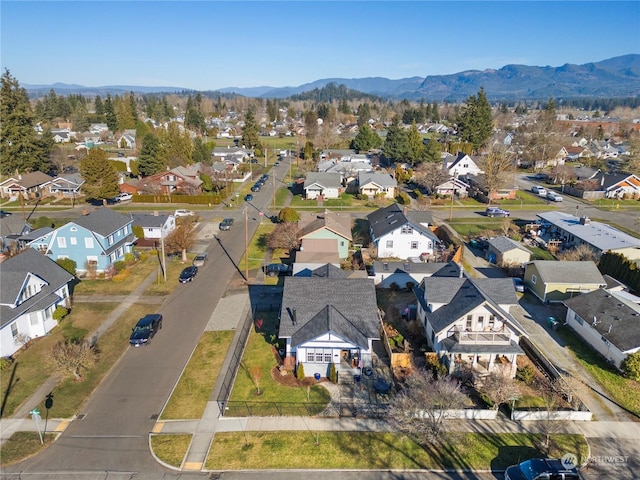 birds eye view of property with a mountain view