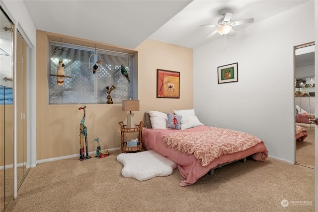 bedroom with ceiling fan, carpet flooring, and a closet