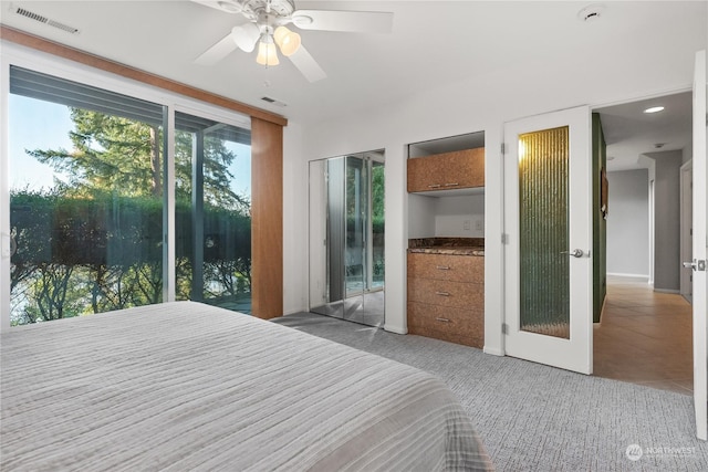 carpeted bedroom with ceiling fan