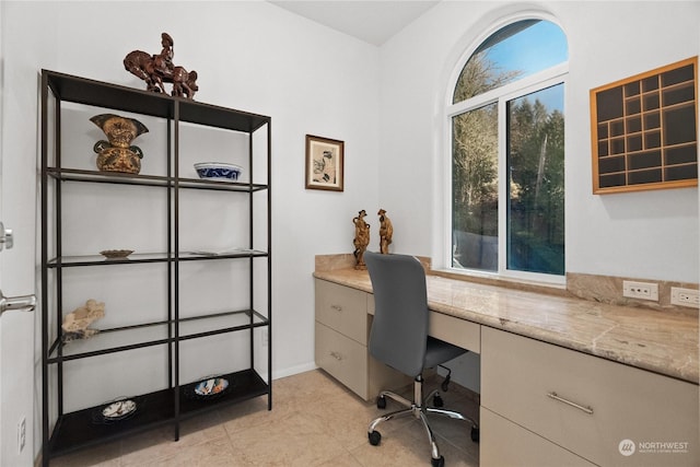 office space with light tile patterned floors