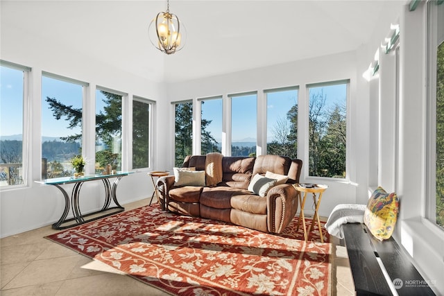 sunroom / solarium with plenty of natural light and a chandelier