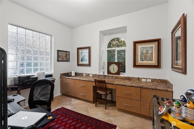 office area with light tile patterned floors