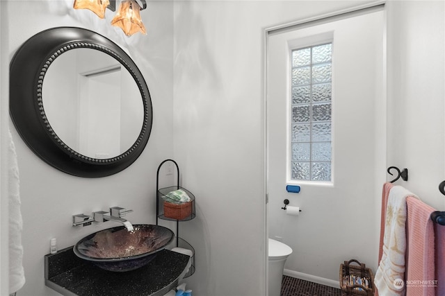 bathroom with sink and toilet