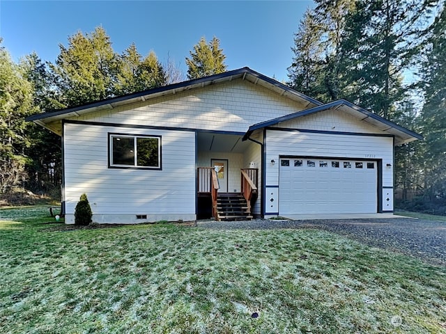 view of front of home with a garage and a front lawn