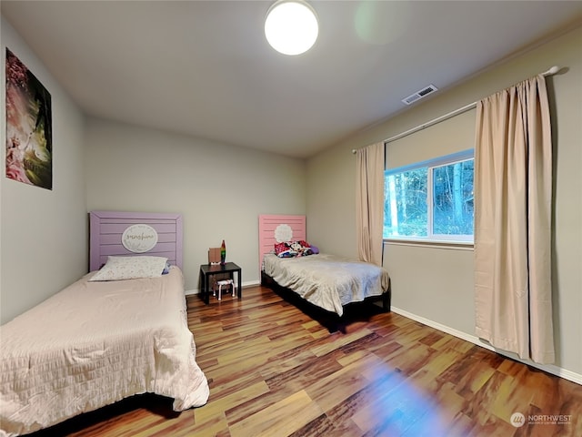 bedroom featuring wood-type flooring