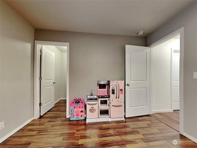 recreation room with light wood-type flooring