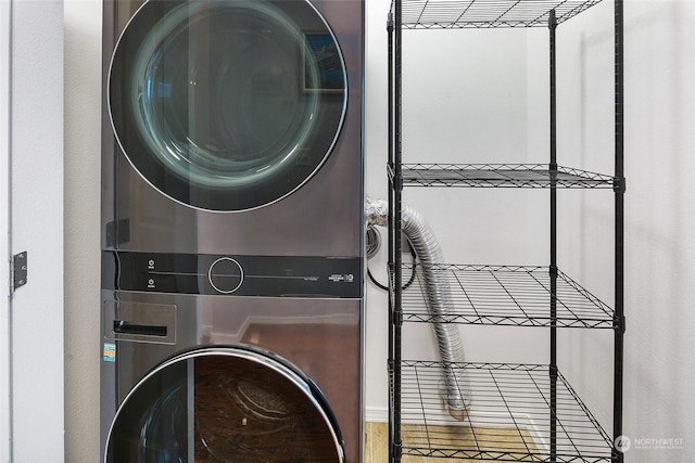 laundry area featuring stacked washer / dryer