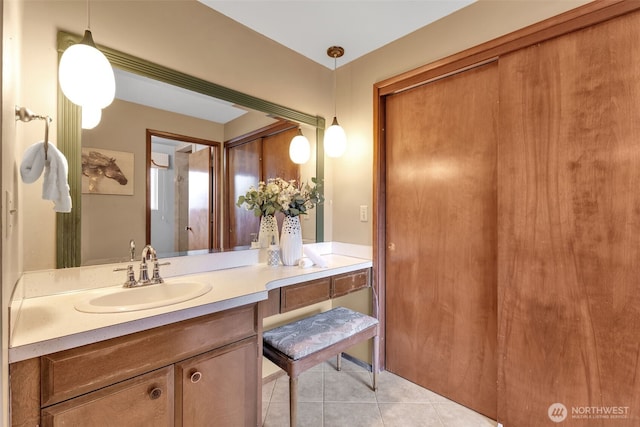 bathroom featuring tile patterned flooring and vanity