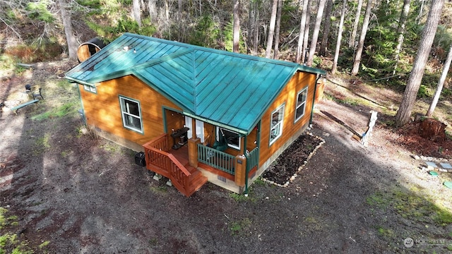 view of property exterior featuring covered porch