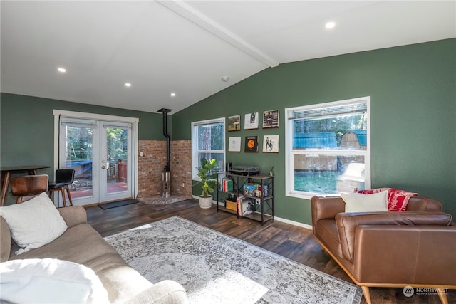 living room featuring french doors, dark hardwood / wood-style floors, a wood stove, and vaulted ceiling with beams